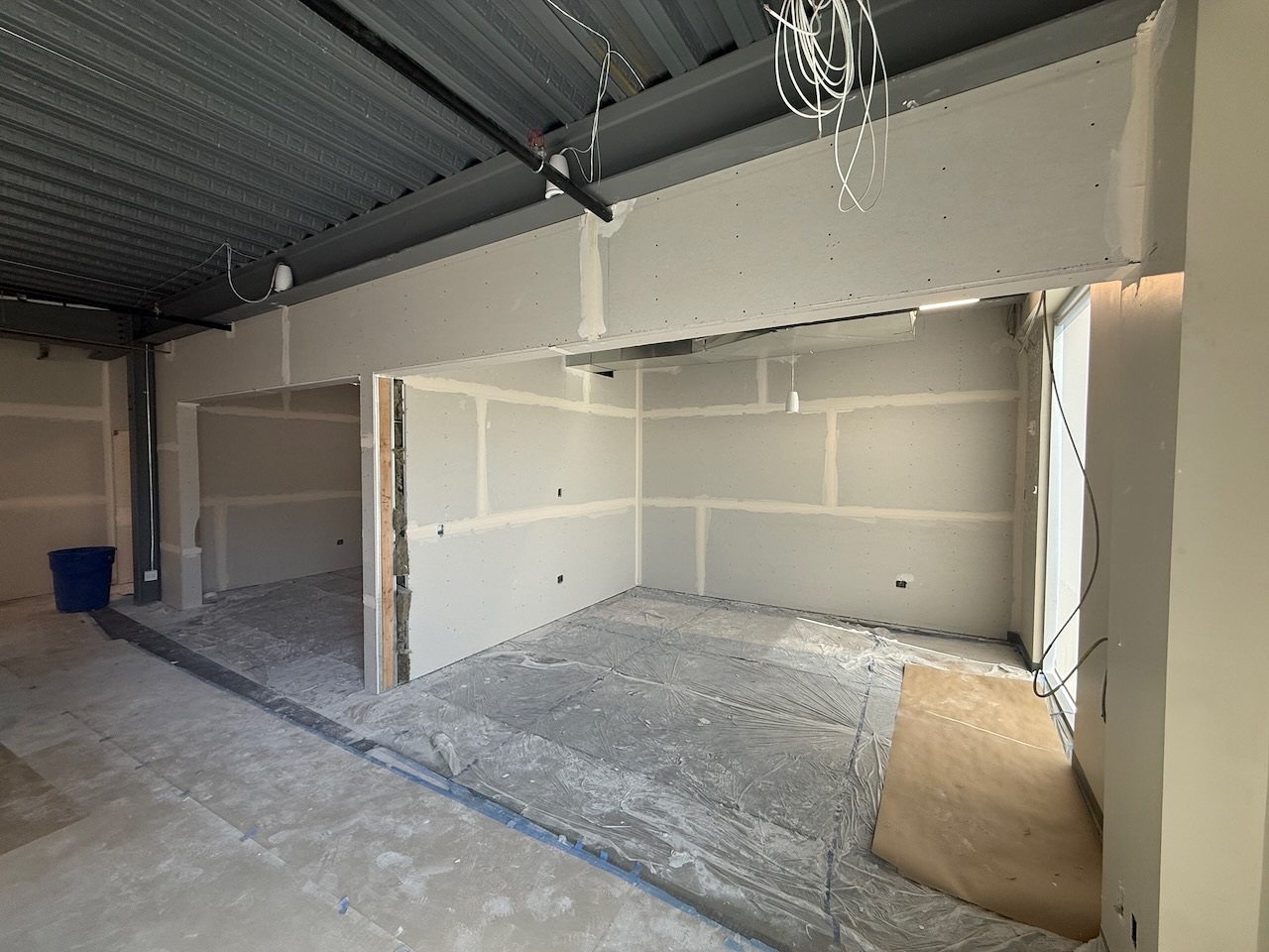 Interior drywall finish work on a Kaart general contracting project, ready for paint